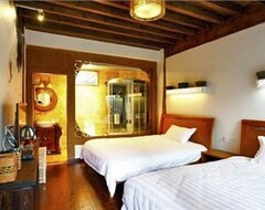 Hotel Shuhe Sancun Sunshine Inn (Lijiang, Kina)