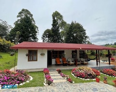Entire House / Apartment Cheerful Villa (Guarne, Colombia)