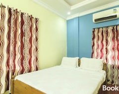 Hotel SPOT ON 39897 Mukkam Tourist Home (Kozhikode, Indija)